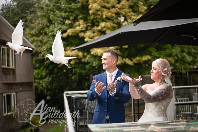 Dove release by bride and groom at The Oaklands Hotel Norwich