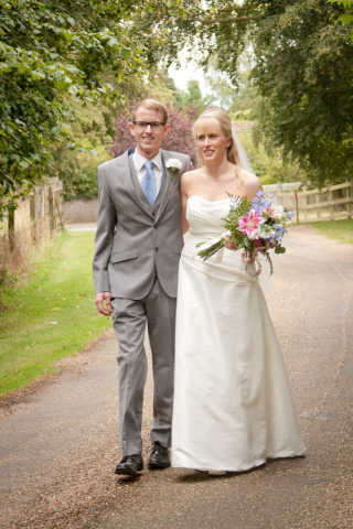 Bride and Groom walking at Broom Hall Country Hotel IP25 7EX