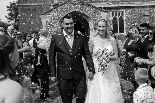 Bride and groom confetti photo at Church in Norwich