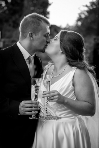 Bride and Groom having a kiss at Glebe Farm Barn NR9 4AP