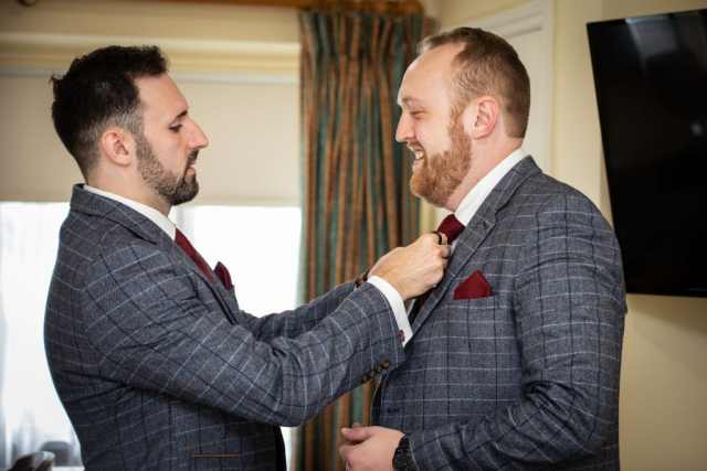 Best man adjusting grooms tie at Knights Hotel Kings Lynn PE30 3HQ