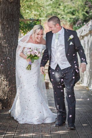 Confeti photo of smiling bride and groom at The Oaklands Hotel Norwich