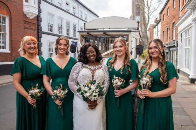 Bride and Bridesmaids in front of wedding car Saint Giles Street Norwich