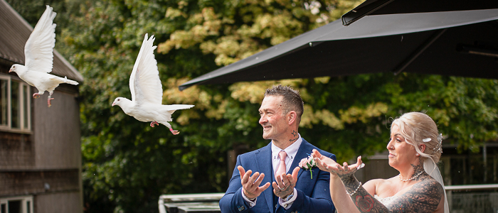 AlanBulldeathPhotographyBanner1 Bride and groom releasing doves at the Oaklands Norwich