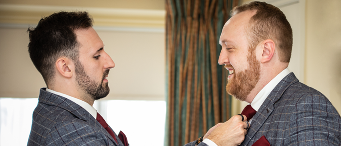AlanBulldeathPhotographyBanner3 Best man adjusting grooms tie at Knights Hill Kings Lynn Norfolk