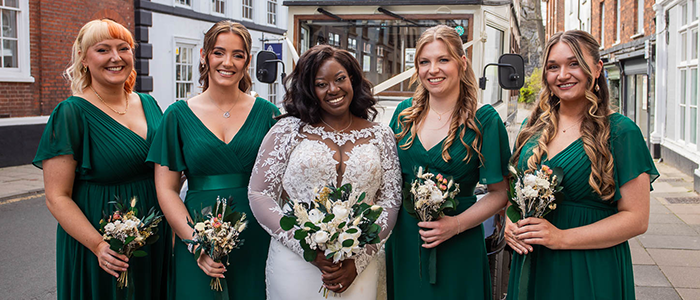 AlanBulldeathPhotographyBanner5 Bride and bridesmaids standing in front of wedding car at Saint Giles Road Norwich